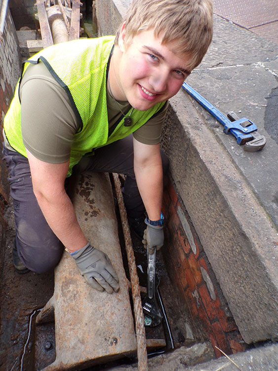 Charlie tightening a holding-down nut in the ram pit